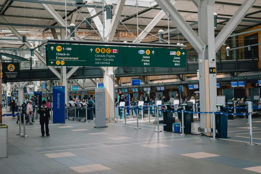 a group of people standing around a terminal