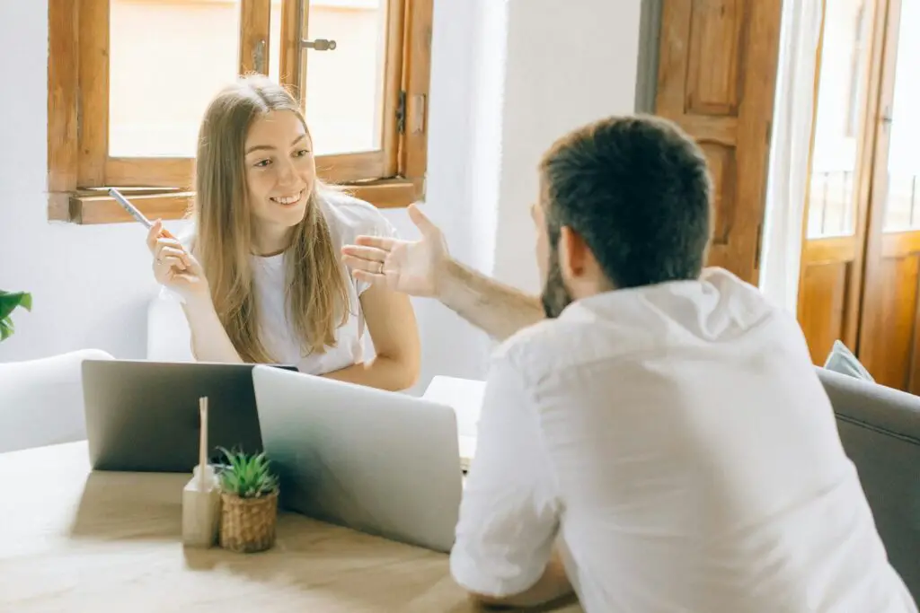 Man and Woman Discussing Work