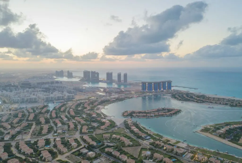 An aerial view of a city and a body of water