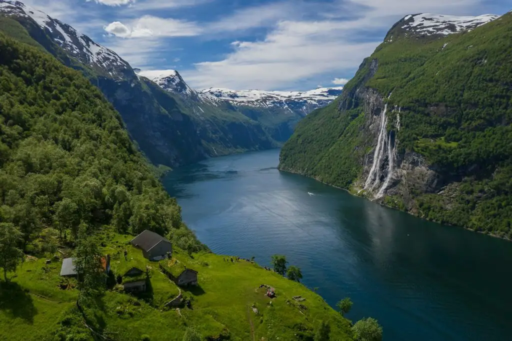 a river running through a valley between mountains