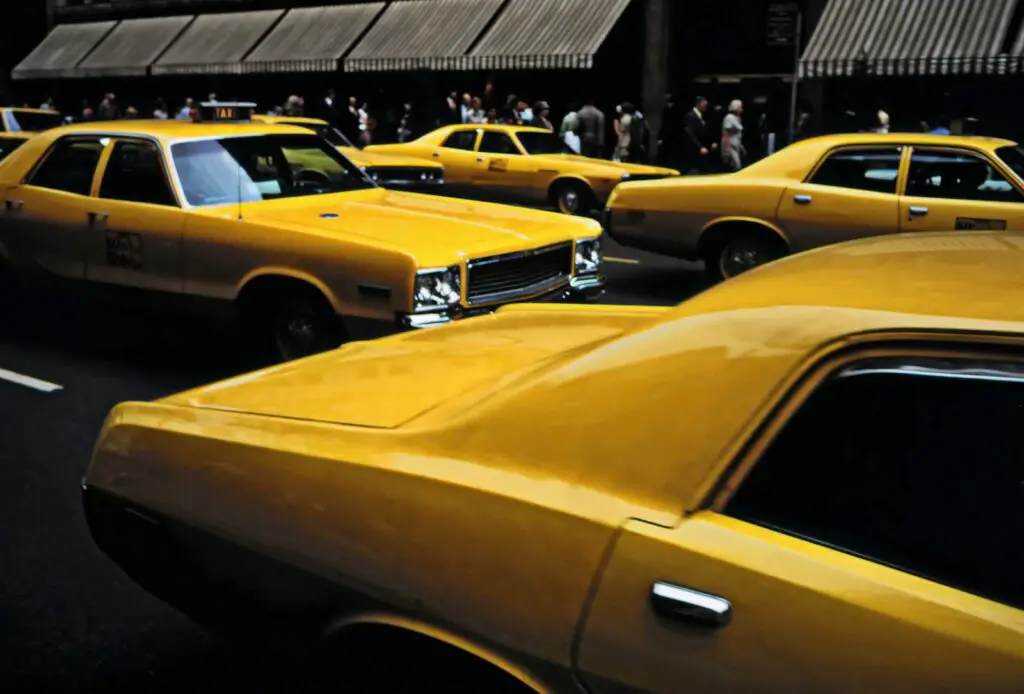 a bunch of cars that are sitting in the street